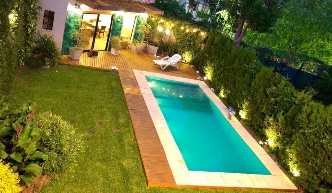 Casa de 280 mts Jardín con Piscina climatizada.